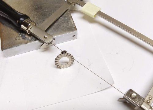 Judy Larson's Ripple Bracelet  - , Metalwork, Cutting, Cutting Tool, Cutters, Dapping, Dapping Jewelry, Filing, Finishing, Findings, Clasps, Components, Tumbling, Tumble, Tumbling Jewelry, Butane Torch, Soldering, Solder, Tools, Use a diamond needle file to clean up the edges of the cut.